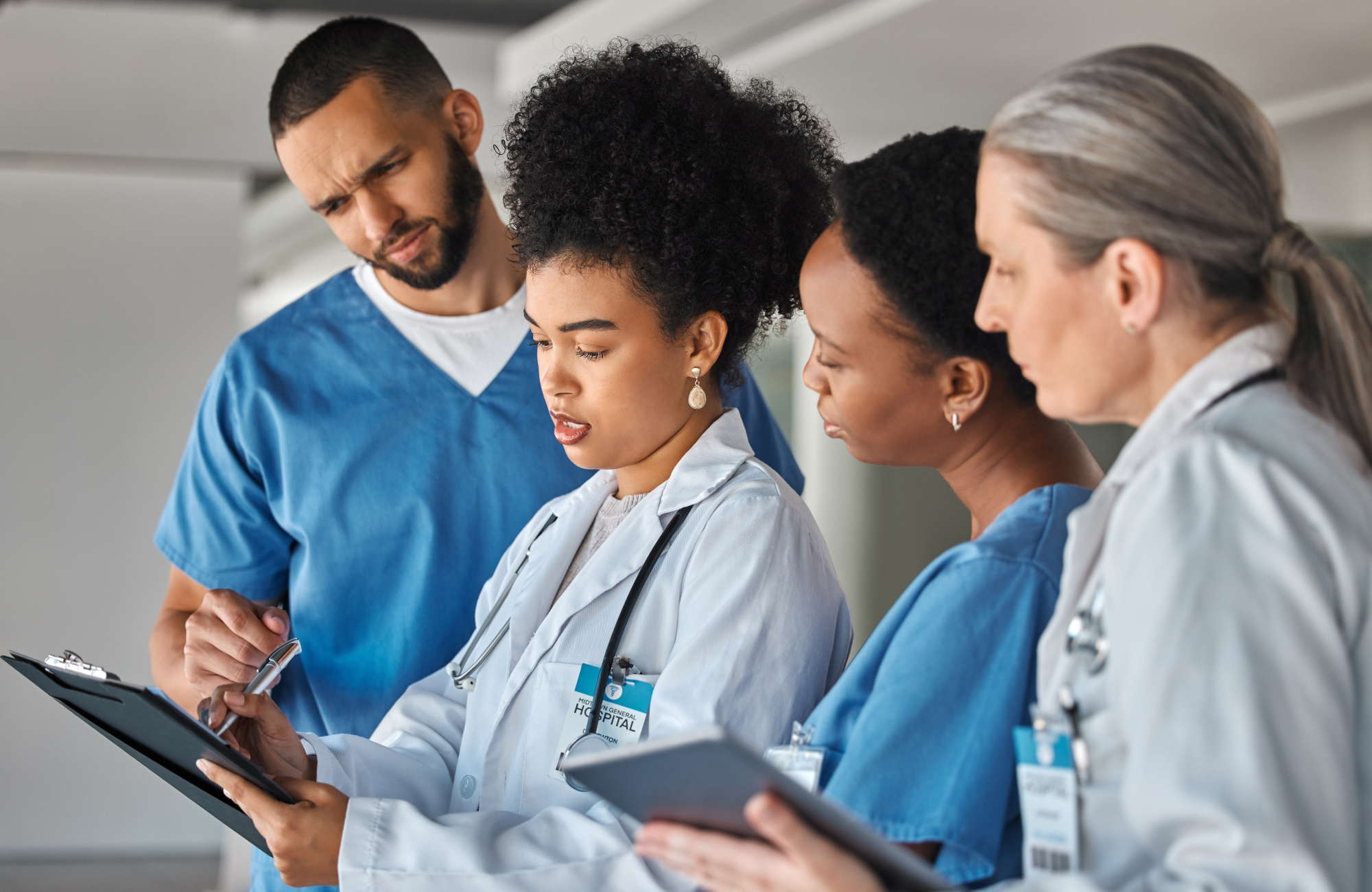 Doctor schedule, meeting and medical worker talking to hospital team about healthcare agenda. Group of medicine employees in communication about collaboration and teamwork on paper in clinic